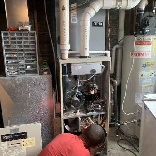 hvac direct technician installing furnace